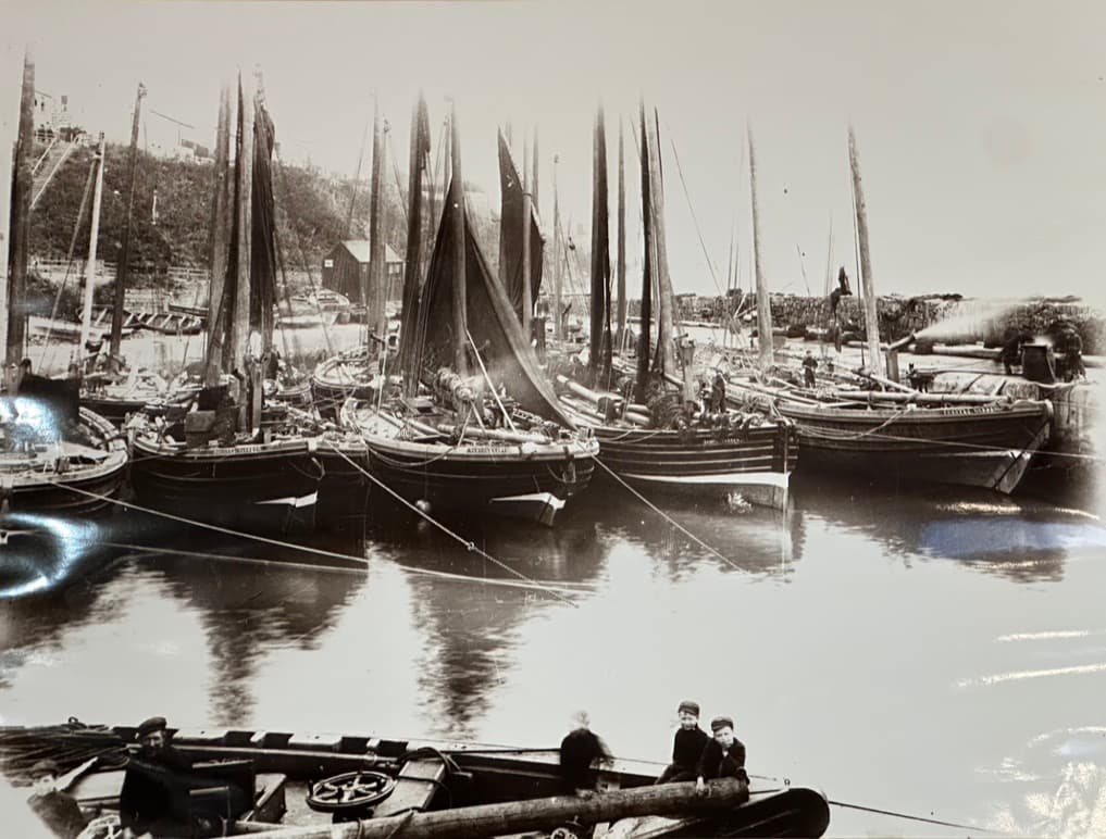A fishing fleet crowds Gardenstown harbour, historic photo