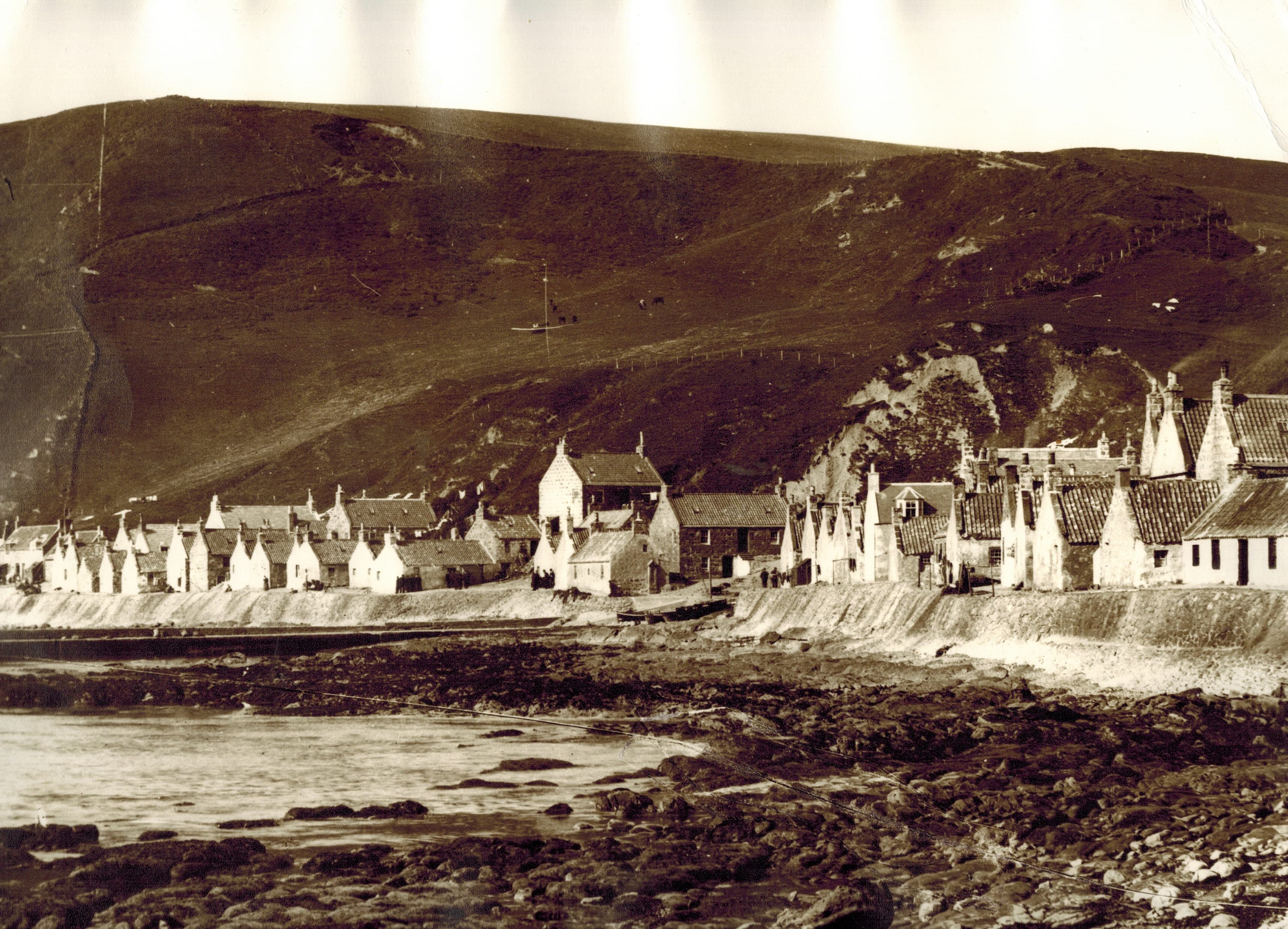 Sepia panorama of the terraced cottages beneath the cliffs, historic photo