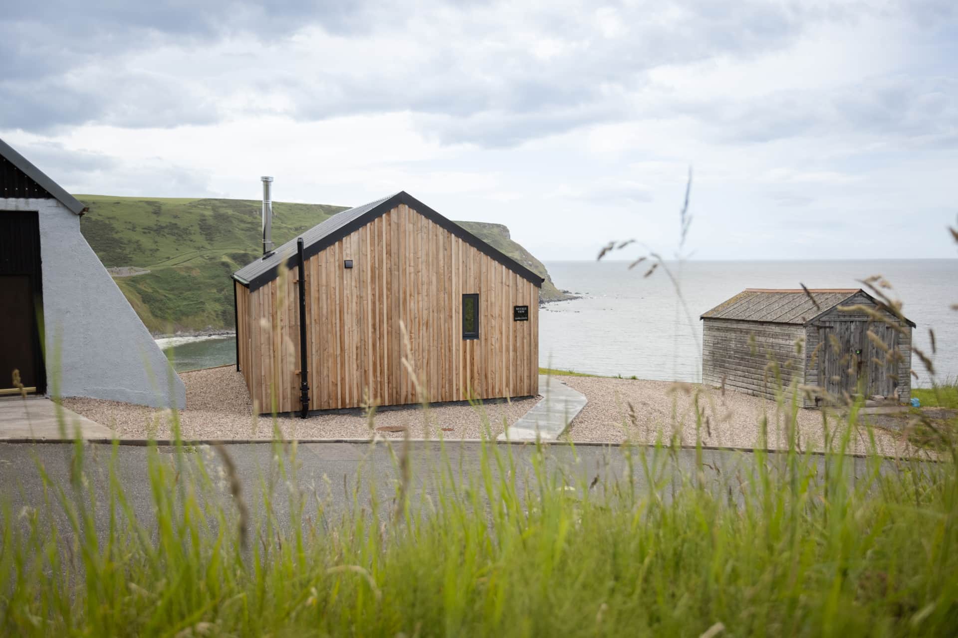 Muckle View chalet above the shore, beside the old boat sheds