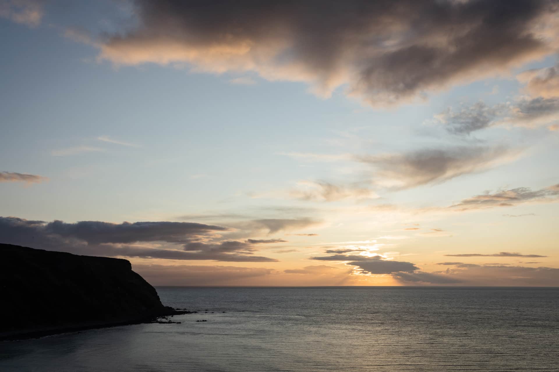 Sunset silhouette over the coast
