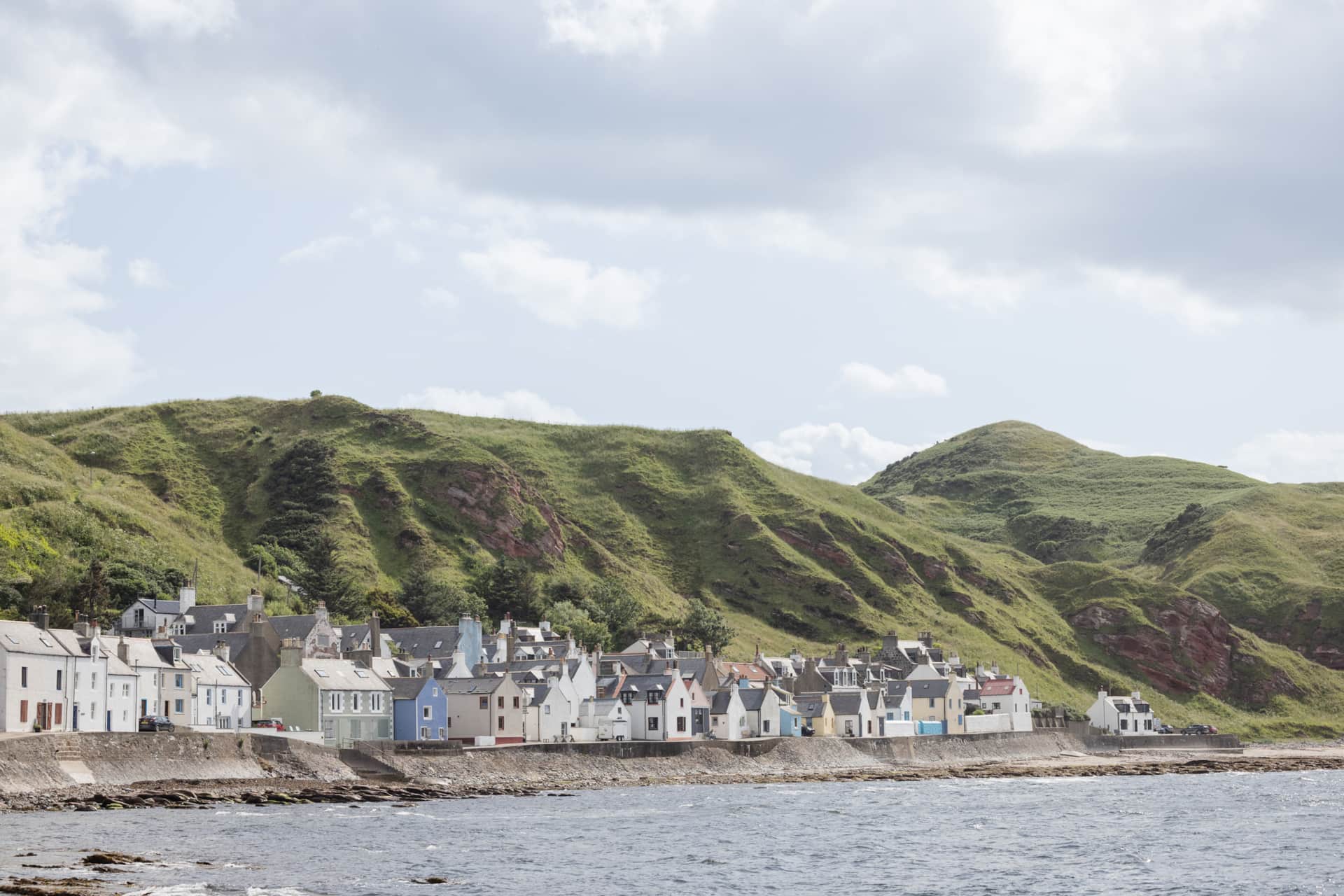 Colourful cottages along the shoreline near Gardenstown