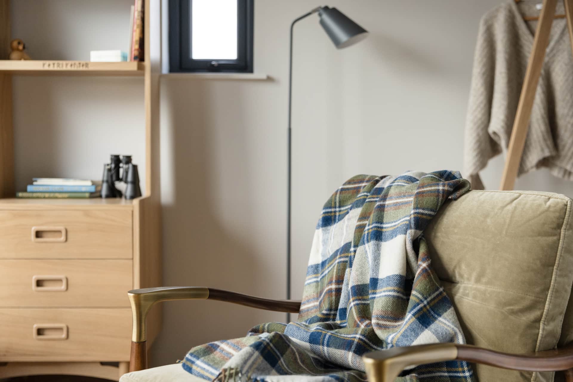 Reading chair with a tartan throw