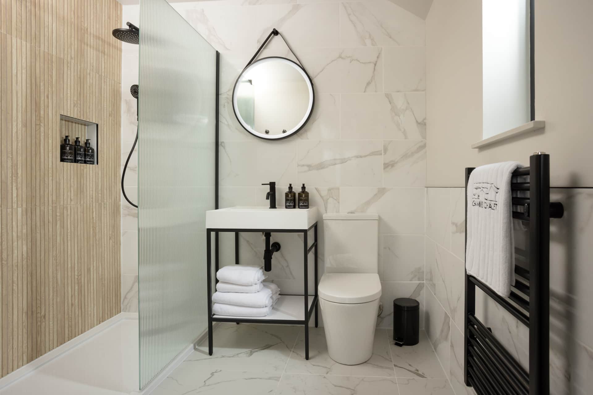 Marble bathroom with walk-in shower and vanity