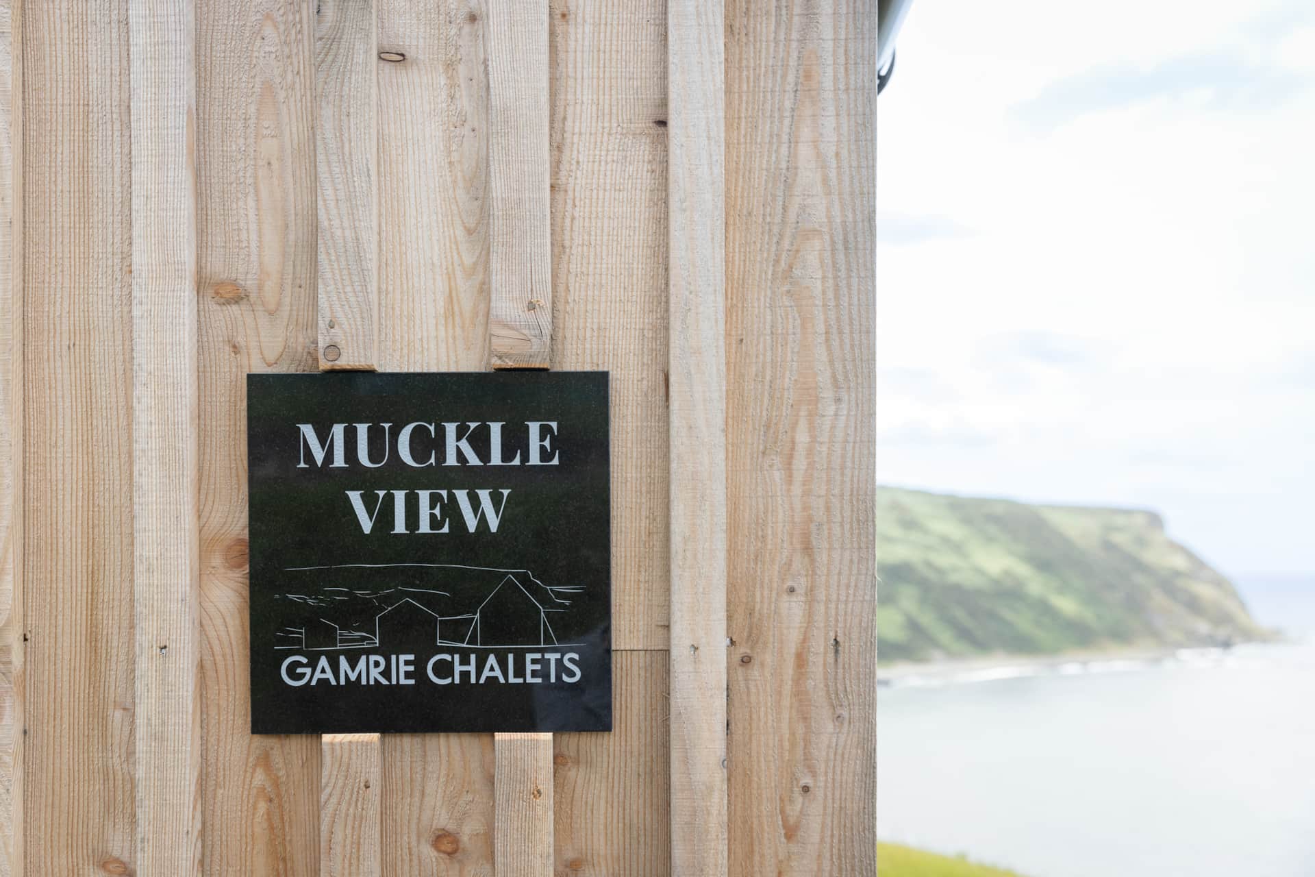 "Muckle View" nameplate on the timber cladding
