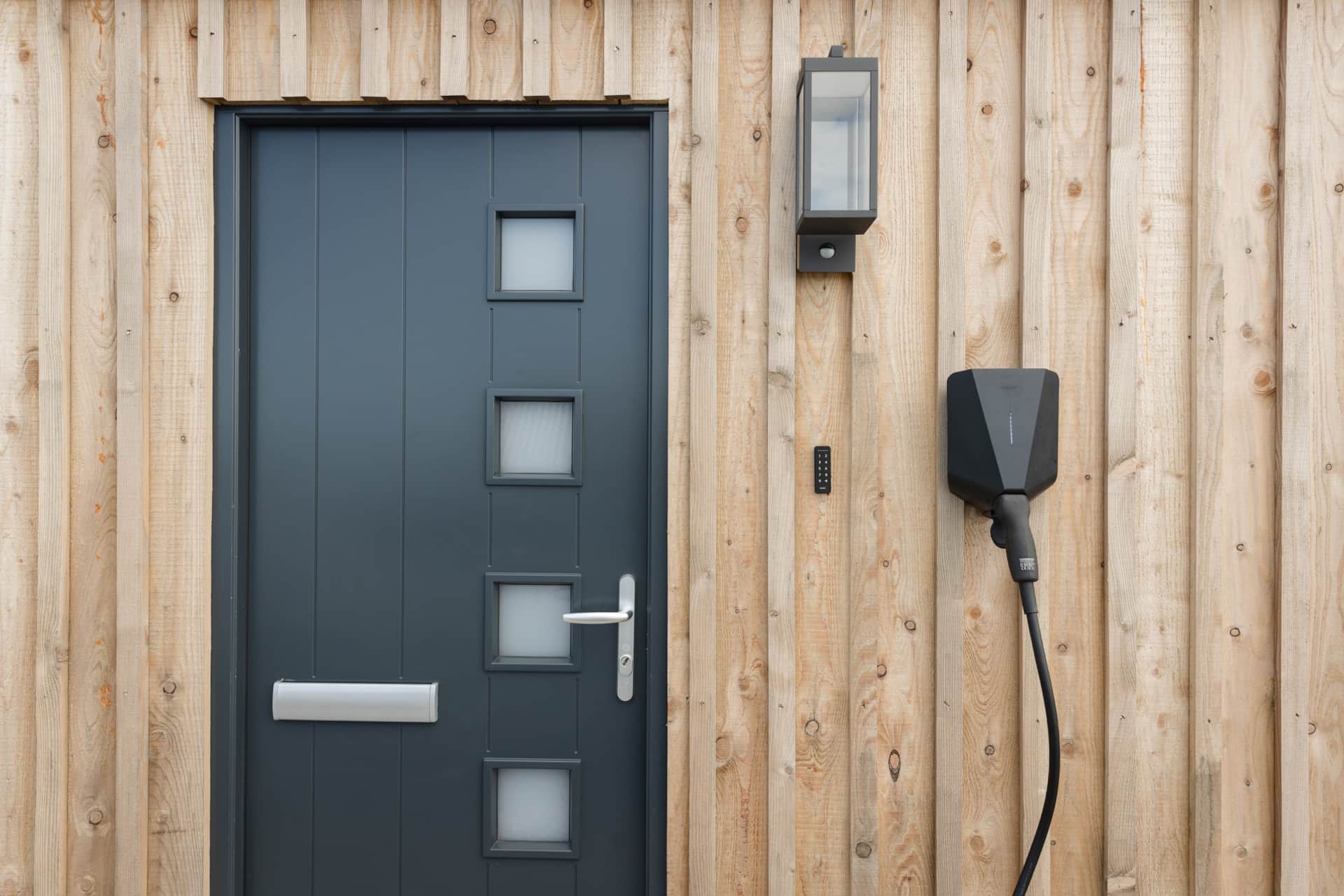 Front door with EV charge point and entry keypad