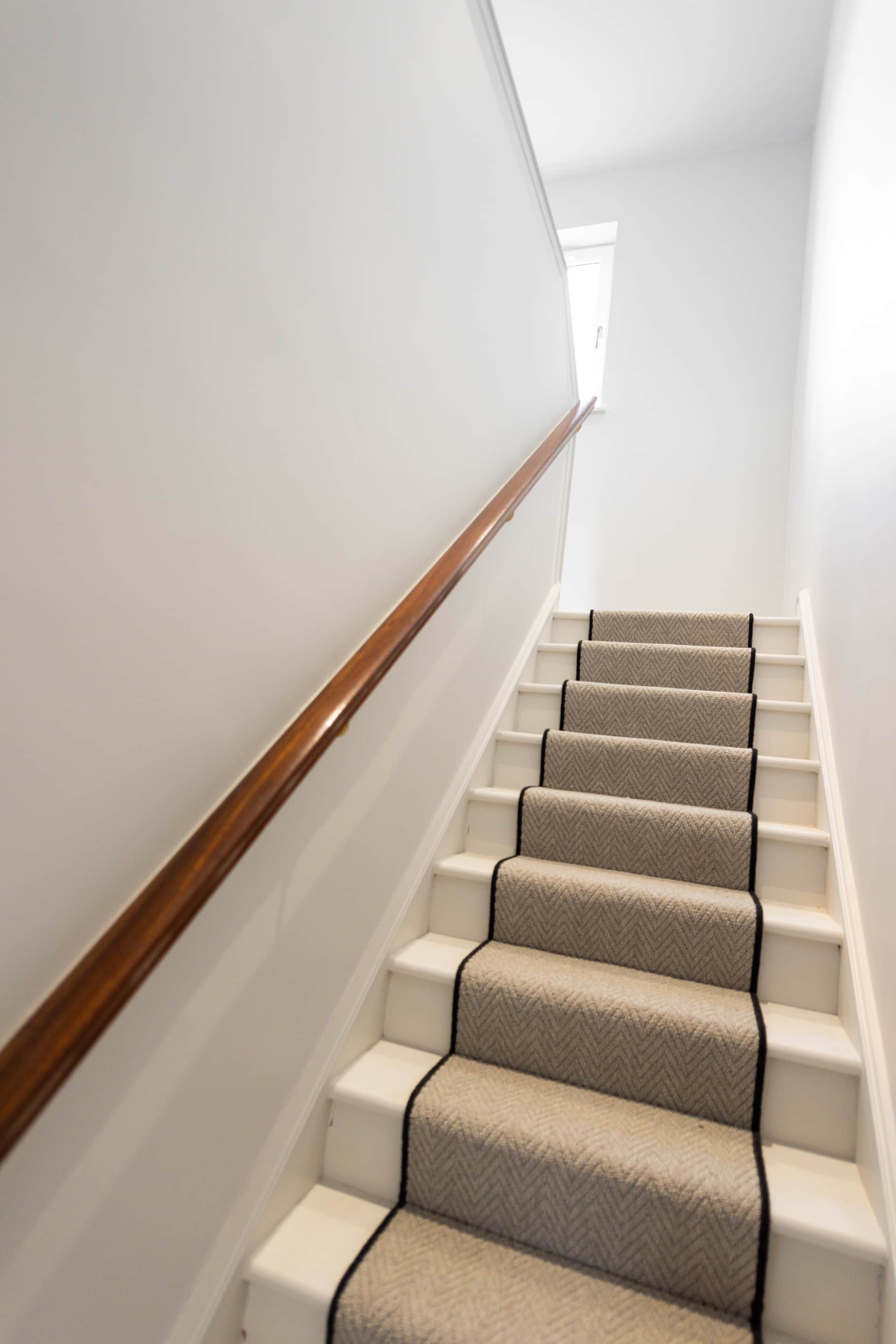 Staircase with a patterned stair runner