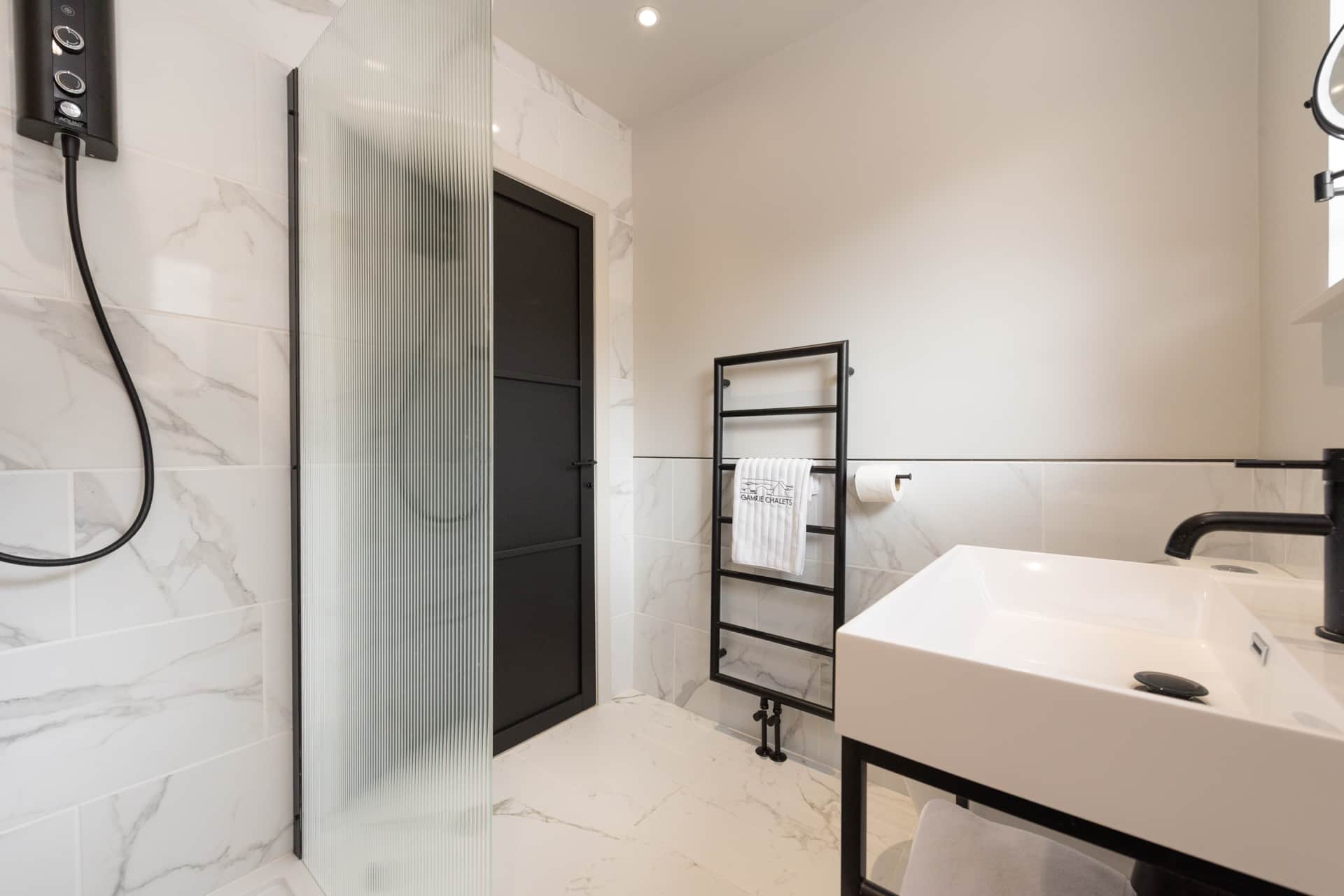 Bathroom sink and heated towel rail