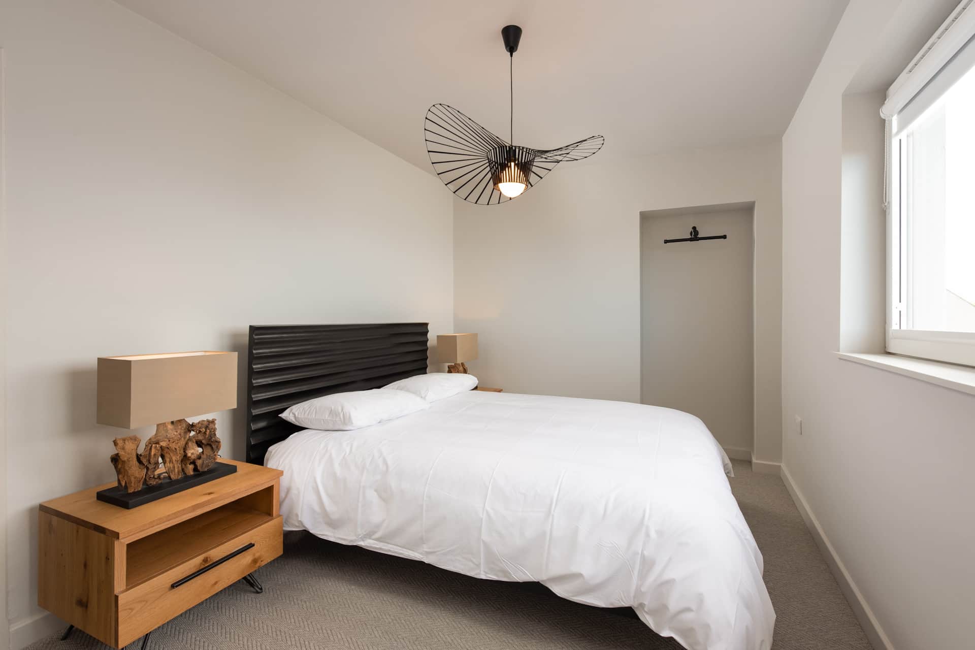 Bedroom with driftwood-base lamps