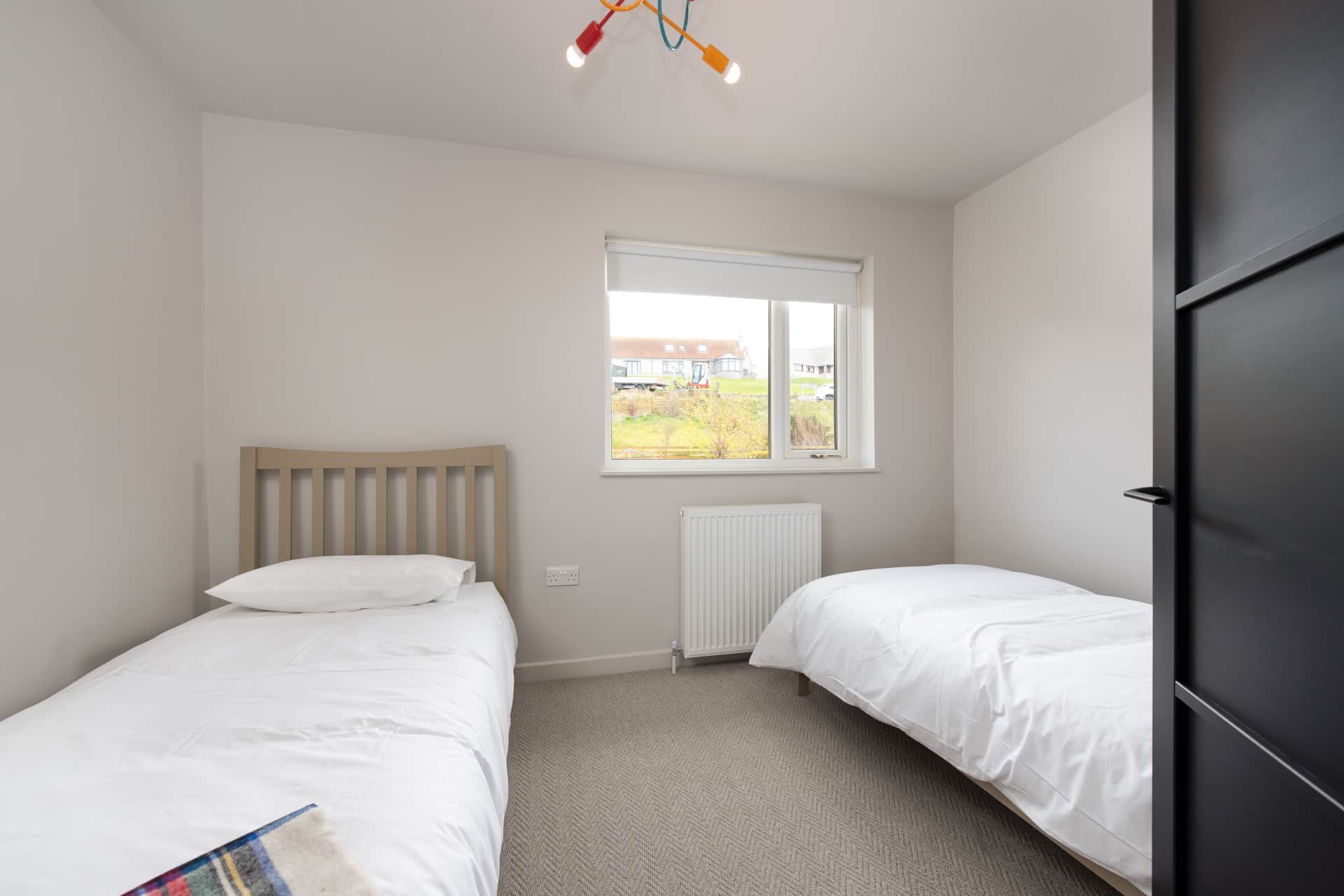 Twin bedroom with garden views